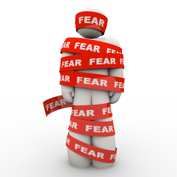 Scared Afraid Man Wrapped in Red Fear Tape